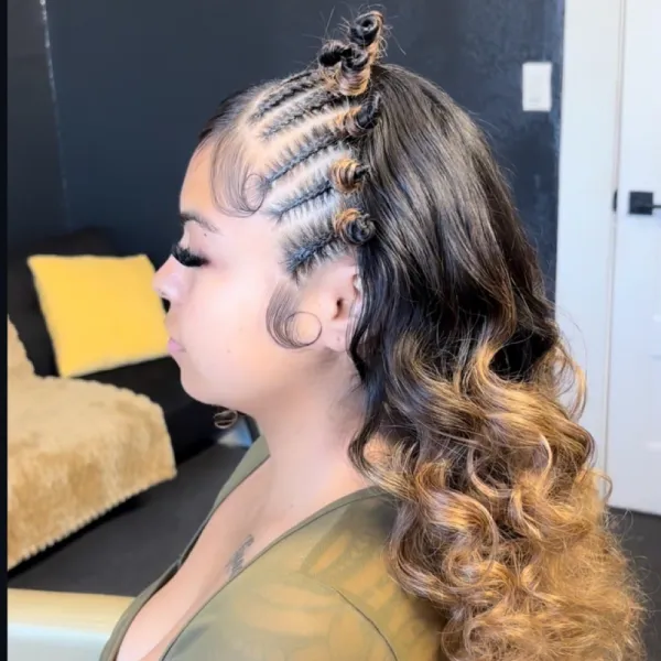 Half-up braided style with curls cascading down